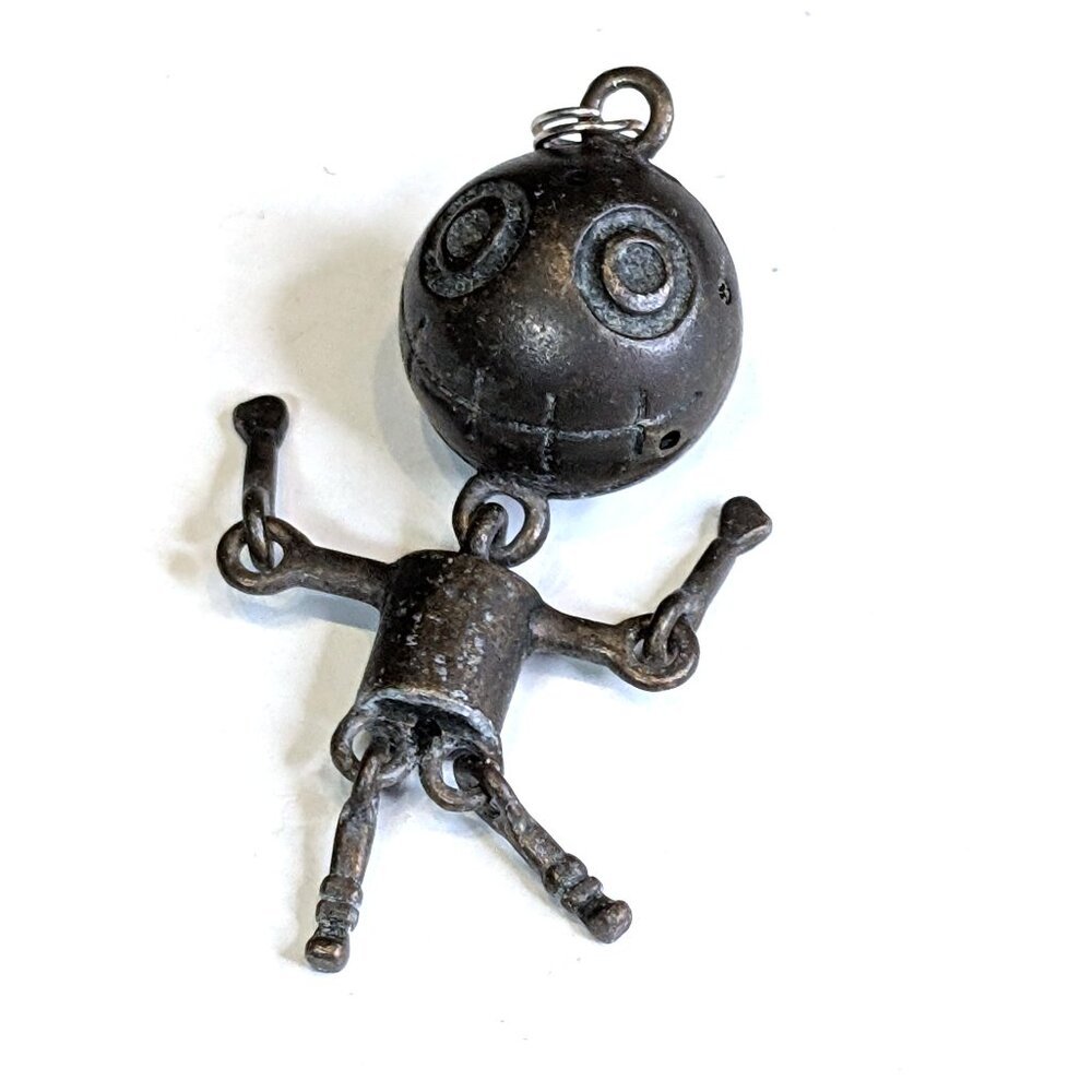 Quirky vintage segmented "sewn-mouth" doll pendant